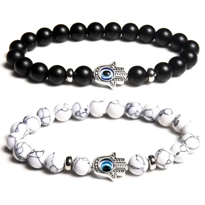 Evil Eye Hamsa Bracelet: matte black stone and white howlite beads with the hamsa charm.