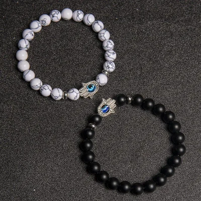 Evil Eye Hamsa Bracelet: matte black stone and white howlite beads with the hamsa charm.